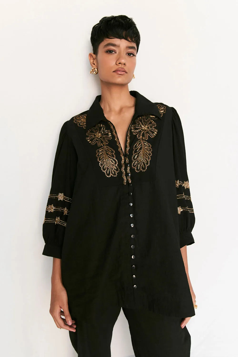 Rimi Co-ord Set women's black cotton outfit featuring a coordinated relaxed shirt and tailored pants, a long shirt silhouette and clean contemporary styling, designed for comfortable travel, elevated daywear, casual gatherings and sophisticated everyday dressing.