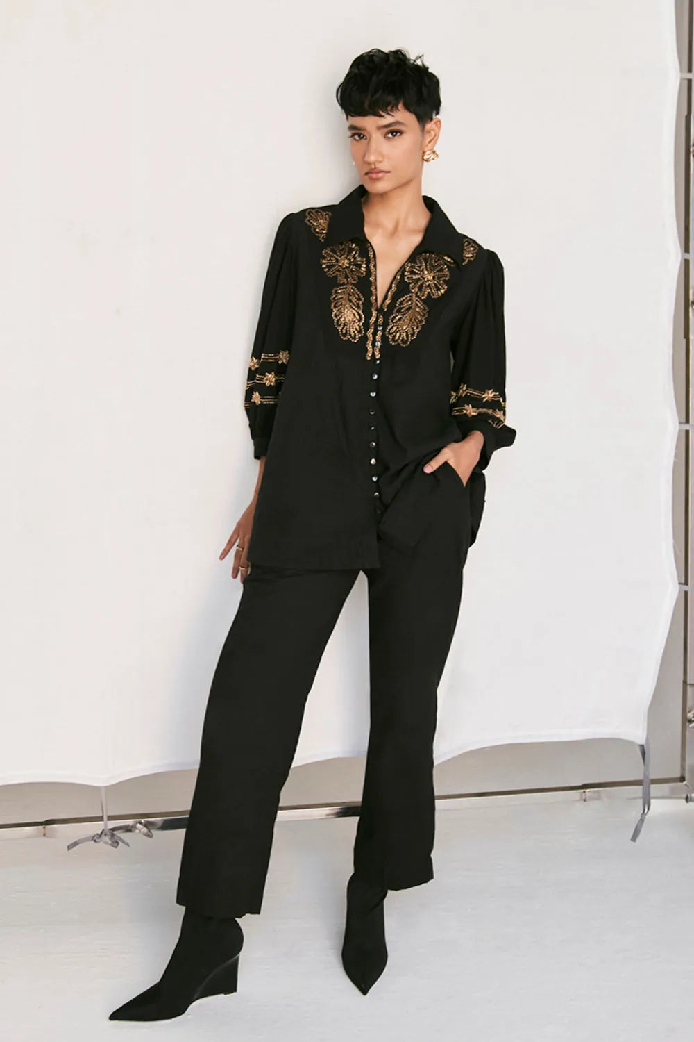 Rimi Shirt women's black cotton shirt featuring a relaxed silhouette, classic collared neckline, button-down front and clean contemporary styling, designed for comfortable everyday wear, styled for casual outings, travel days, brunches and smart-casual occasions.