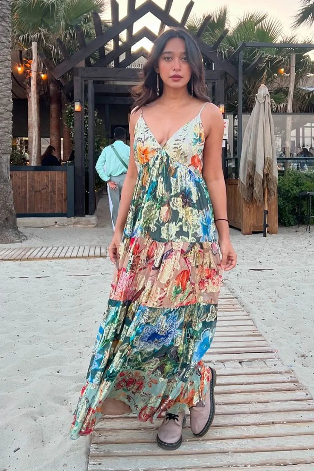 Sayani Gupta wearing the Katherine Maxi Dress, a women's multicolour viscose Lurex Georgette maxi dress featuring a vibrant jacquard print, delicate spaghetti straps and a subtle shimmering finish, styled for summer holidays, destination celebrations, festive evenings and resort occasions.
