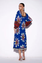 Back view of Tatiana Tier Maxi Dress women's multicolour maxi dress featuring a vibrant printed design, delicate straps and a flowing tiered skirt, creating a feminine, airy silhouette for resort vacations, summer holidays, garden parties and destination celebrations.
