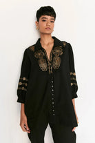cwomen's black cotton shirt featuring a relaxed silhouette, classic collared neckline, button-down front and clean contemporary styling, designed for comfortable everyday wear, styled for casual outings, travel days, brunches and smart-casual occasions.