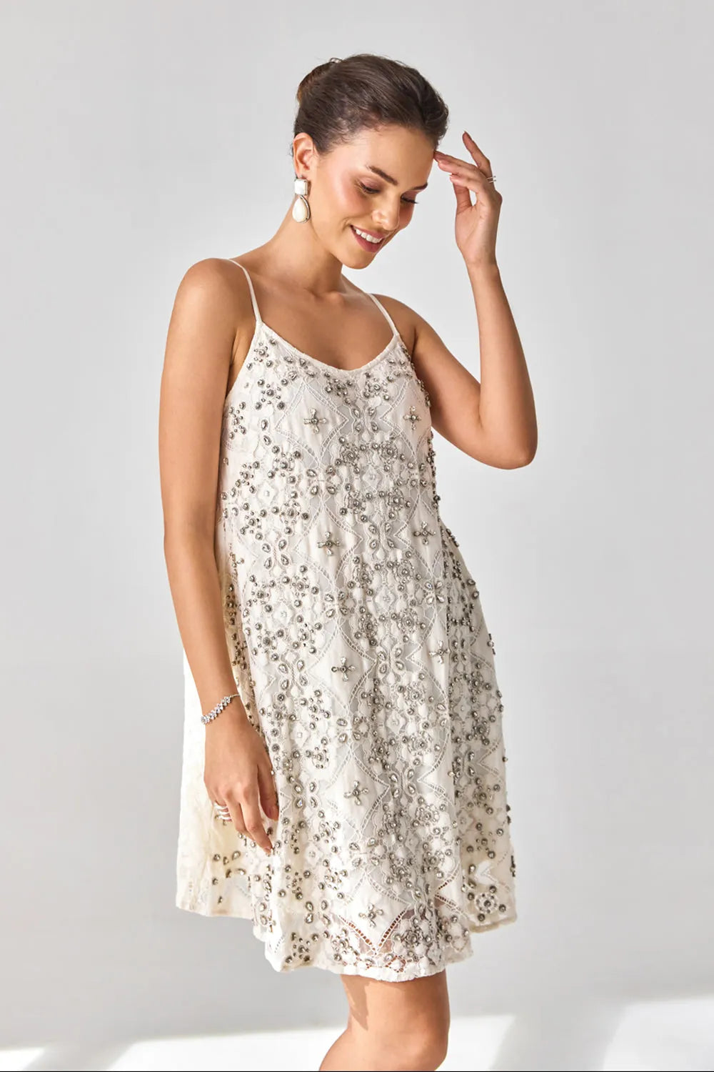 Rosa Anglasia Studded Dress women's statement dress featuring intricate studded embellishments and a feminine silhouette, designed to create an eye-catching look for festive celebrations, resort evenings, cocktail gatherings and special occasions.