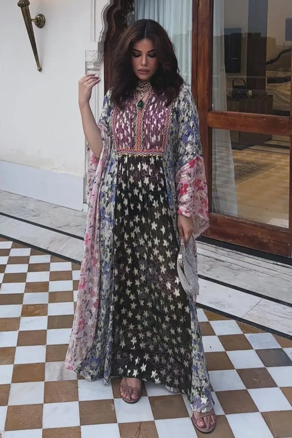 Roshni Bhatia wearing the Karissa Embroidered Kaftan, a women's flowing kaftan featuring intricate embroidery and a relaxed silhouette, styled for beach holidays, resort vacations, poolside lounging and elegant summer getaways.
