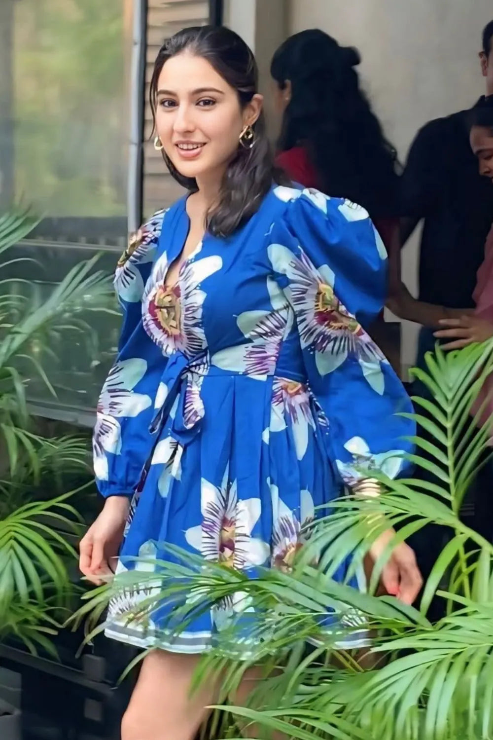 Sara Ali Khan wearing the Amara Mini Dress, a women's cobalt blue cotton satin mini dress featuring a vibrant printed design, a relaxed swing silhouette and a flattering above-the-knee length, styled for summer outings, resort holidays, brunches and daytime celebrations.