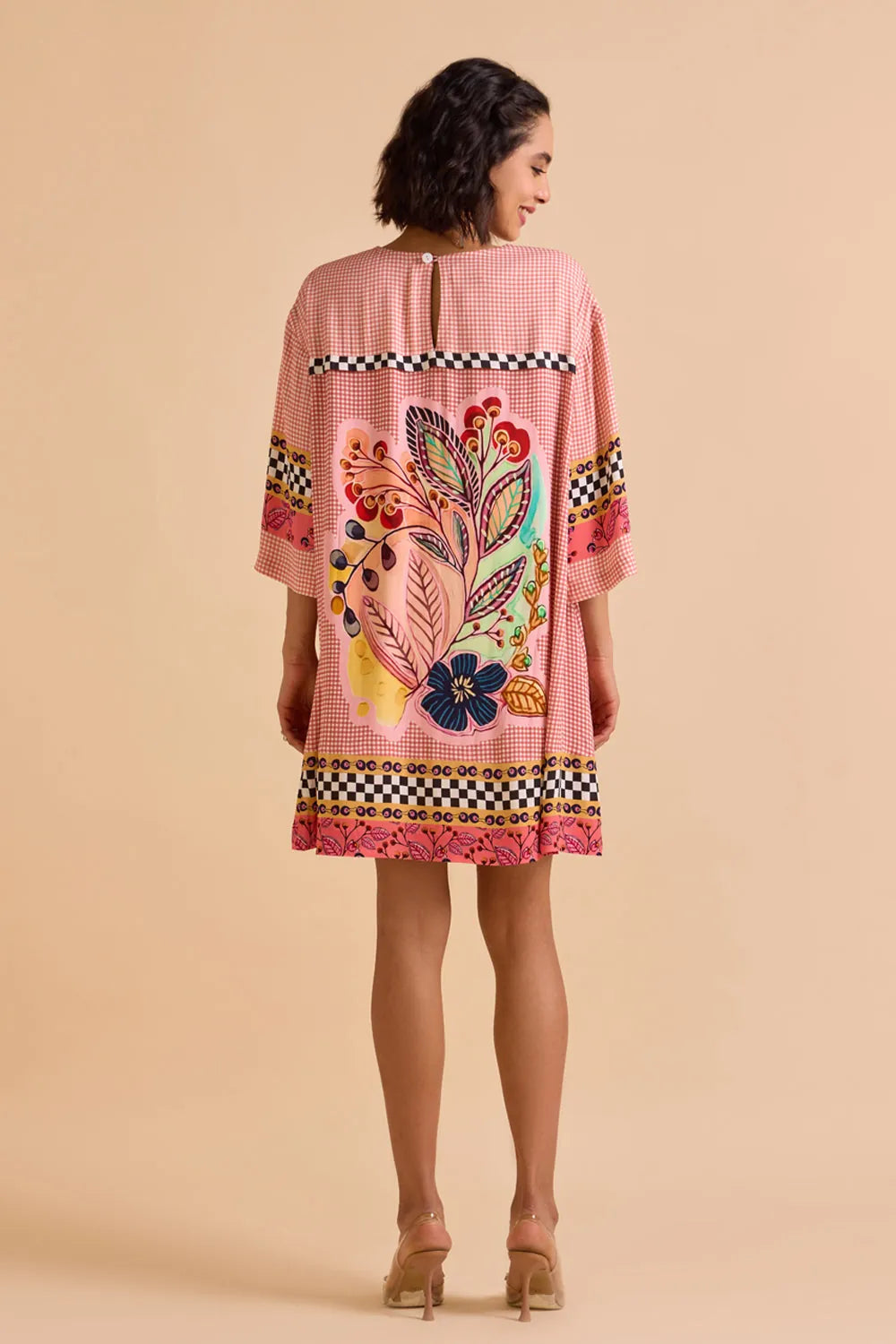 Zion Dress women's statement dress featuring a contemporary silhouette and distinctive design details, styled for summer outings, resort vacations, brunches and special occasions.